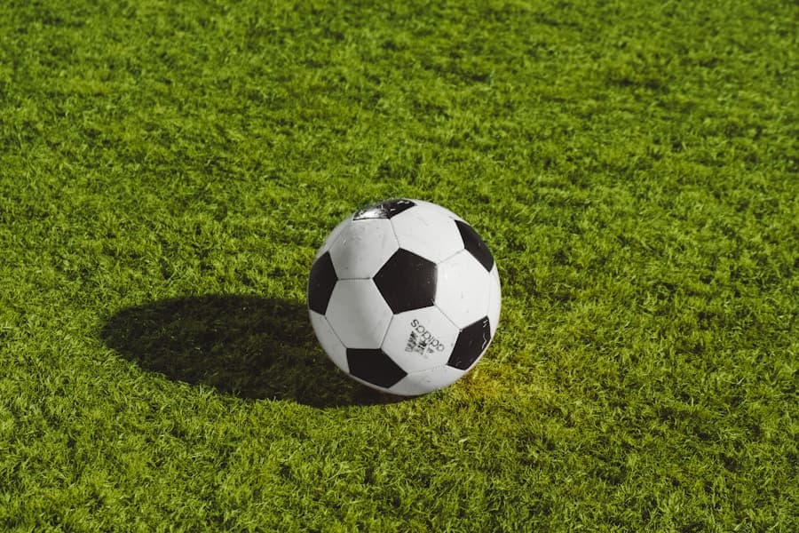 A classic football on a green pitch